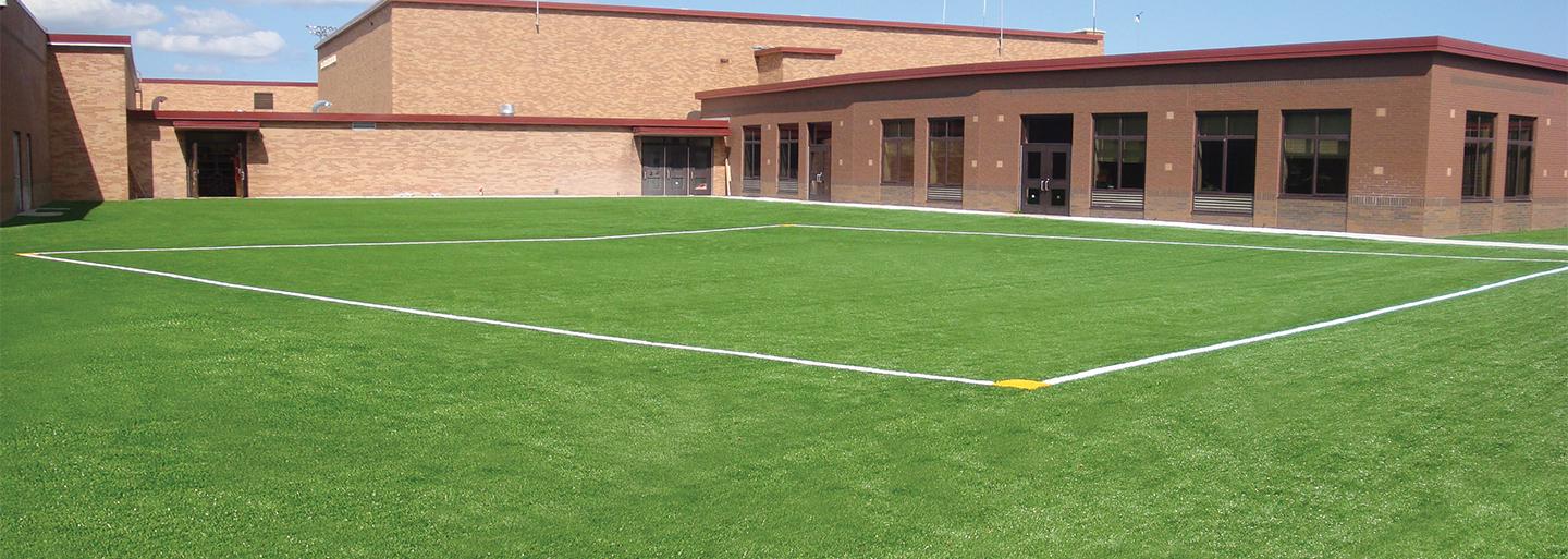 A shot of recreational turf spaces from a school