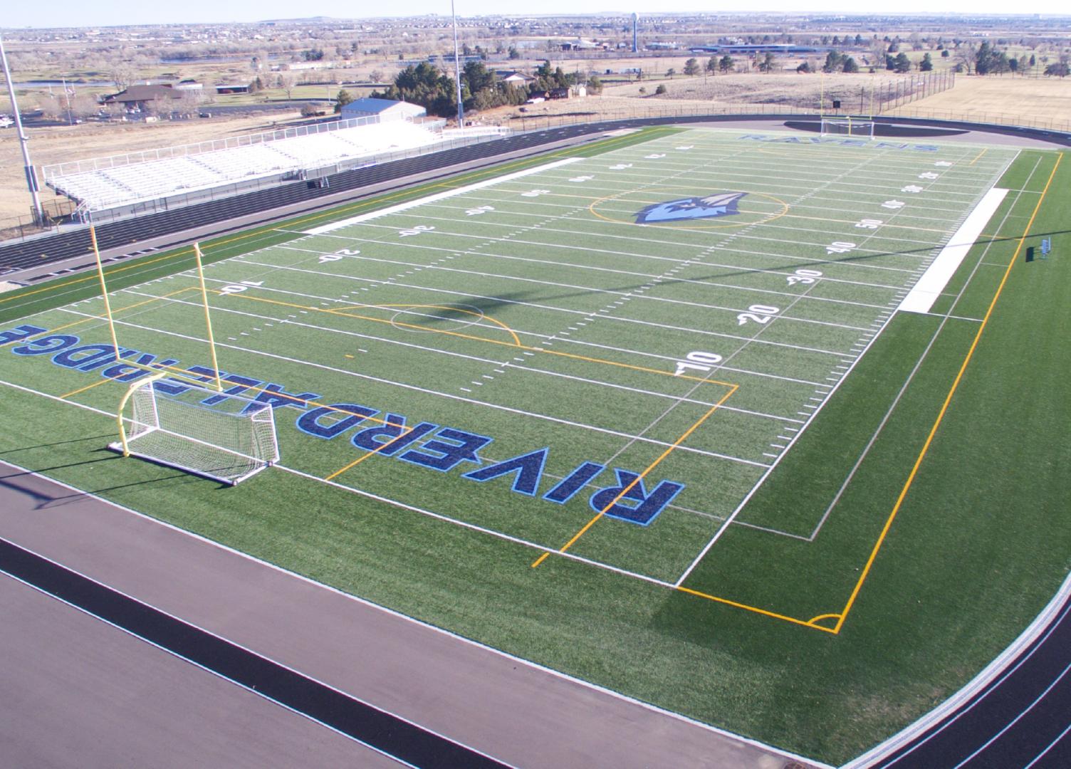 A wide top down shot of a turf field with Clash Turf installed