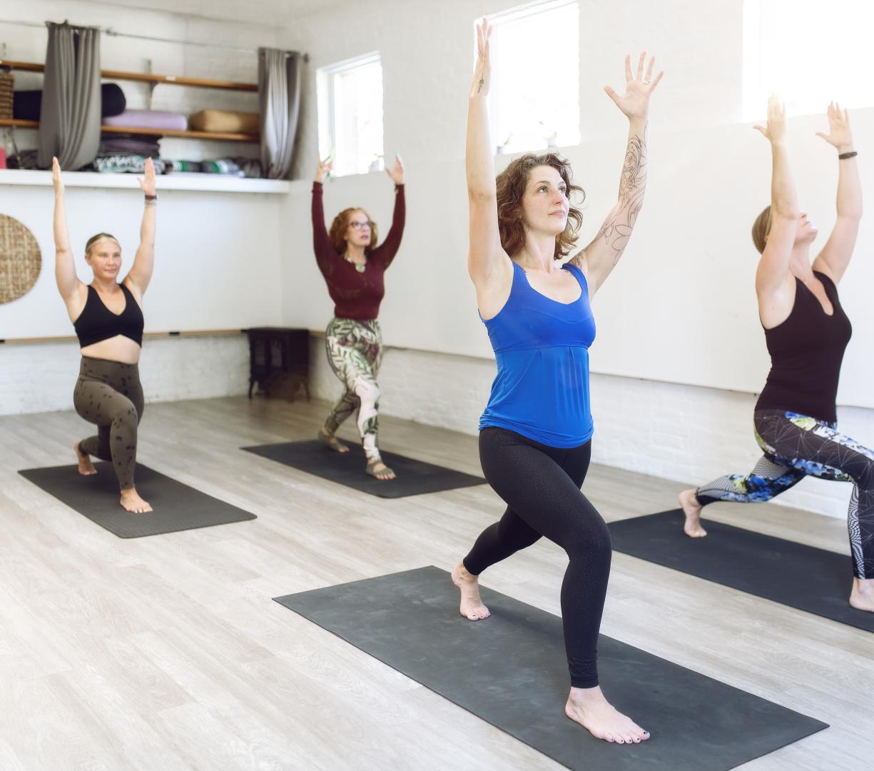 A group of women doing yoga on Heritage Motivate