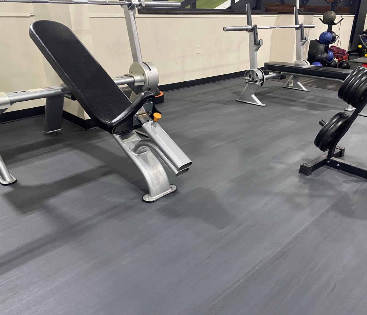 Selectorized Strength Machines in a gym over Moxie Collection flooring