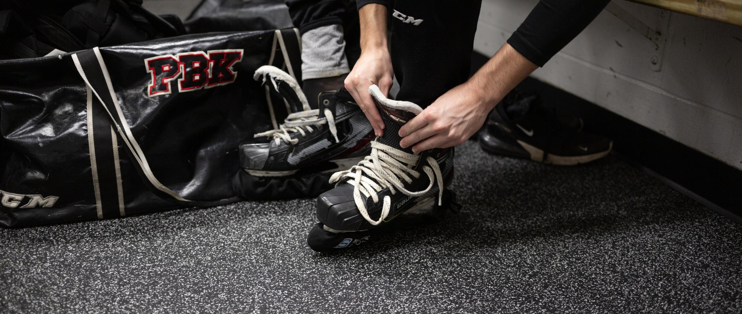 An athlete getting ready for ski & skate sports