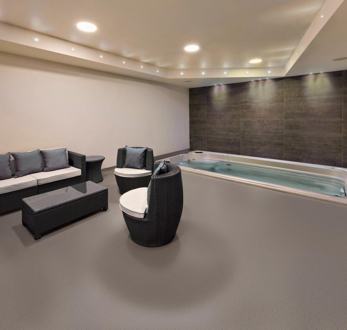 A hydro therapy area with a pool, a waiting area, and Ecore flooring
