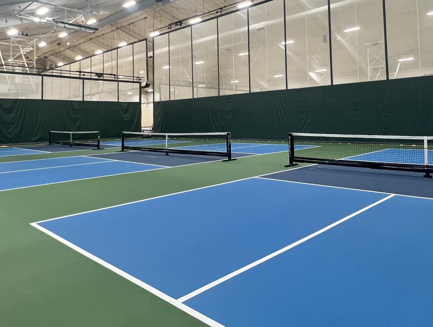A line of Ecore Athletic pickleball courts