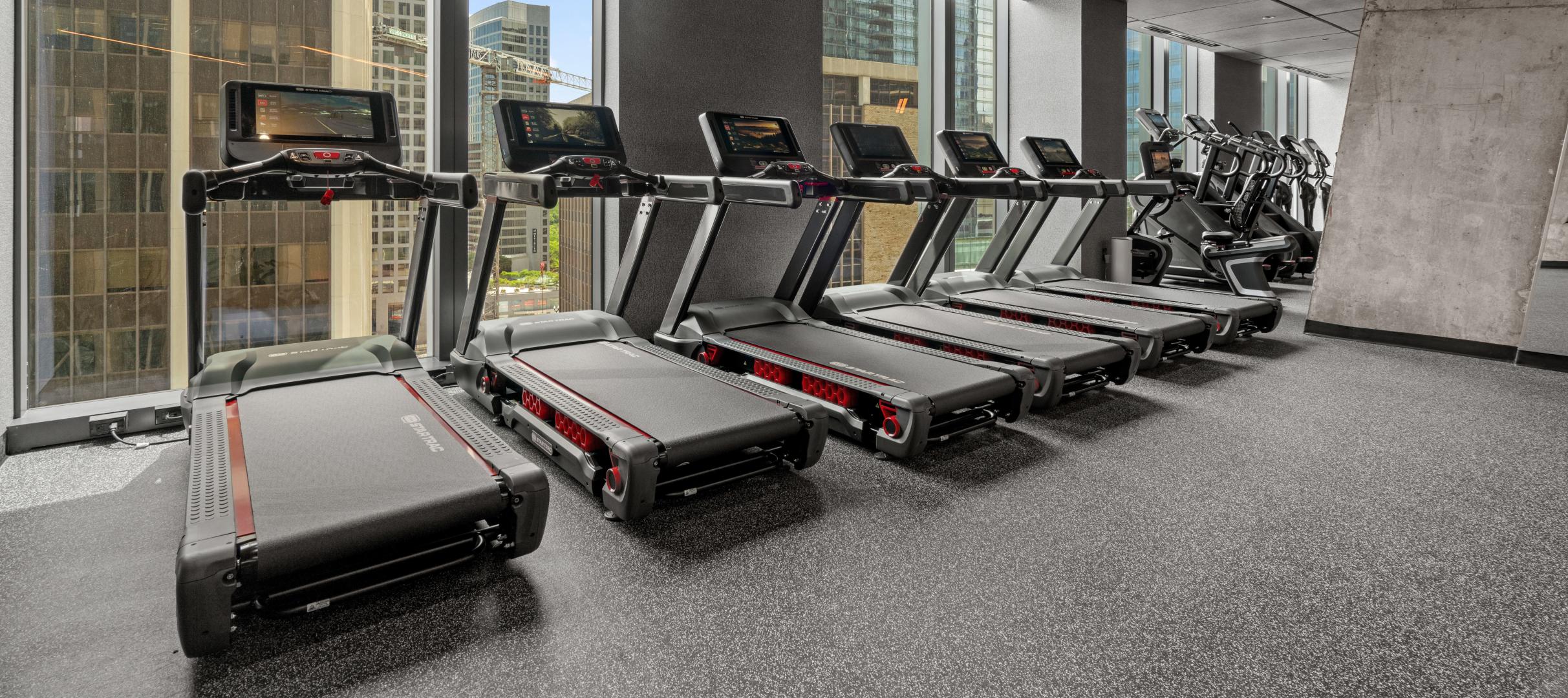 A line of treadmills in a gym