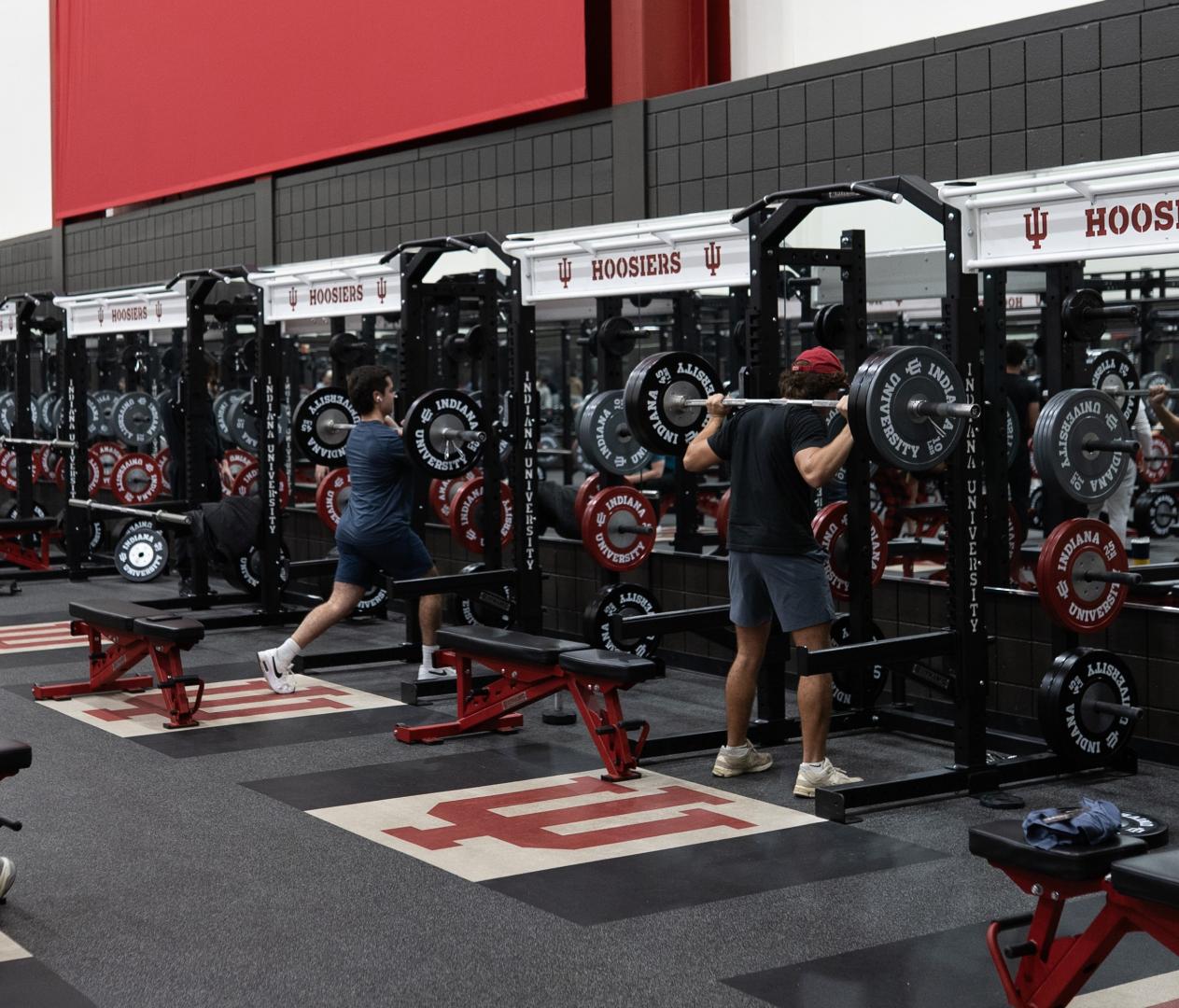 Two athletes working out in a college facility on Performance Beast flooring