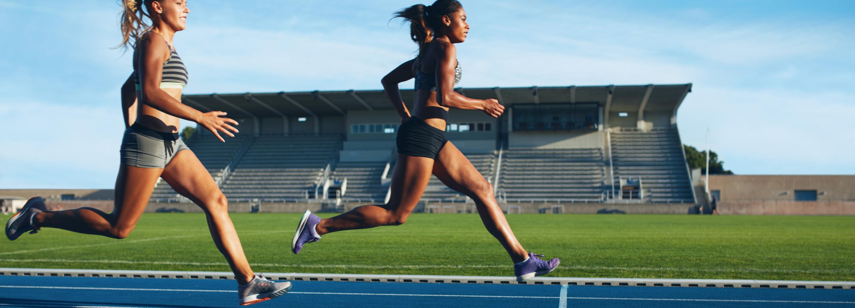 two athletes sprinting on Ecore tracks