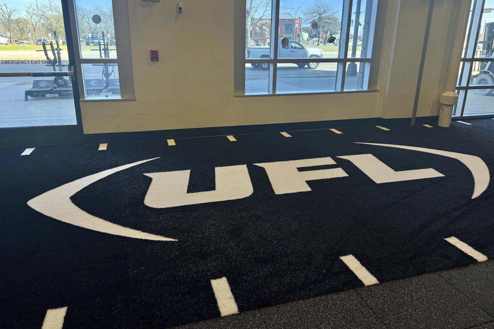 A turf logo installed showing the UFL logo