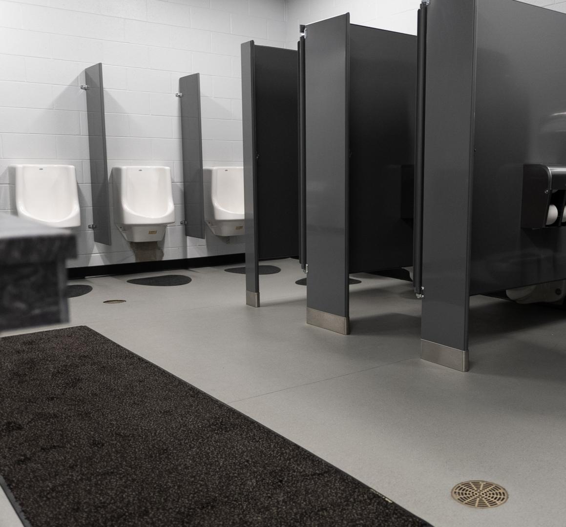 A bathroom with hydrogrip motivate installed as the floor
