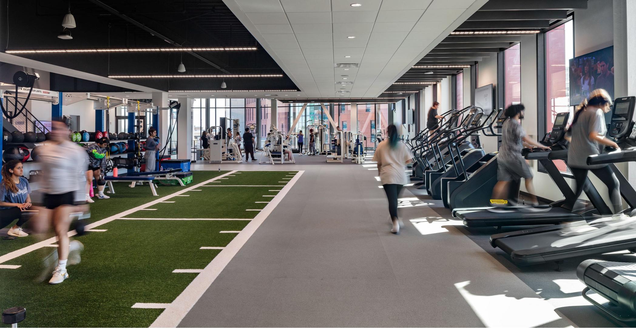 A group of students working out in a fitness center