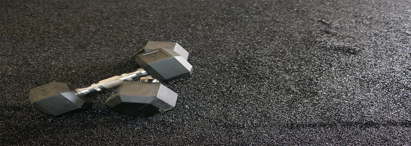 Dumbbells laying on flooring